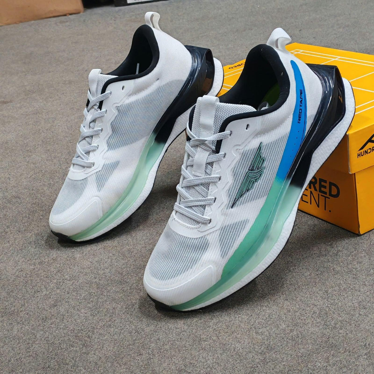 White and teal premium running mesh sneakers for men by Mesmerizeecom.