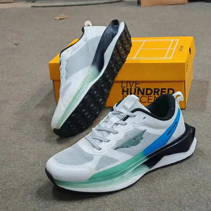 Pair of white Mesmerizeecom premium running mesh sneakers with blue and green accents.