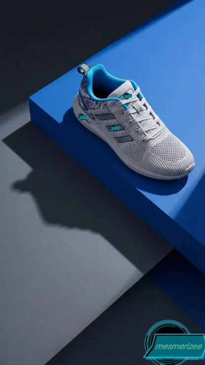 Mesmerizee light grey premium running mesh sneakers for men on a blue platform