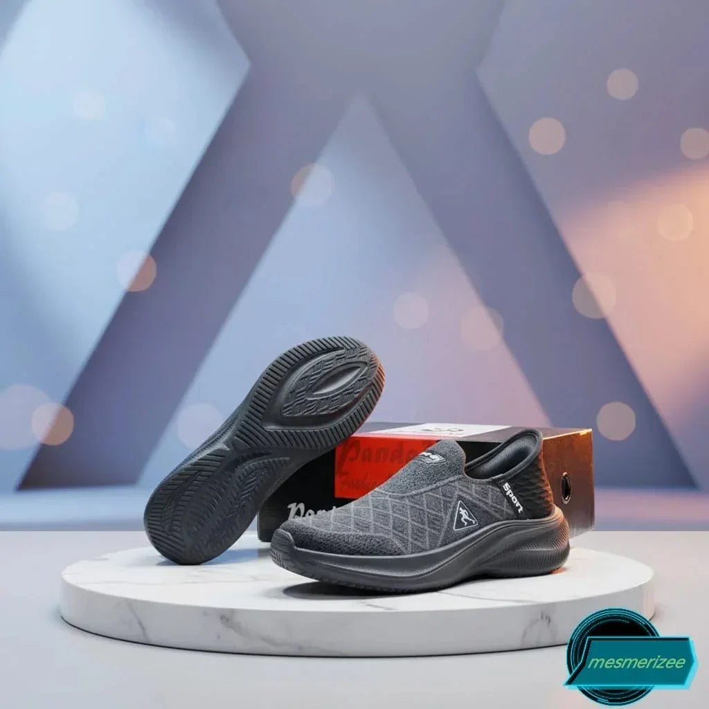 Dark grey premium running mesh sneakers for men by Mesmerizeecom on a marble pedestal