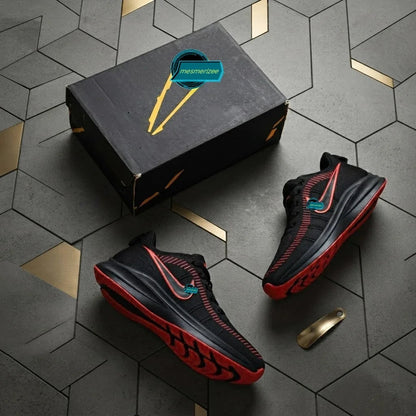 Mesmerizee black premium running mesh sneakers with red accents and matching shoebox.