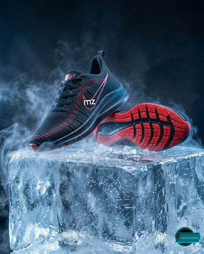 Mesmerizee black premium running mesh sneakers on an ice block with mist.
