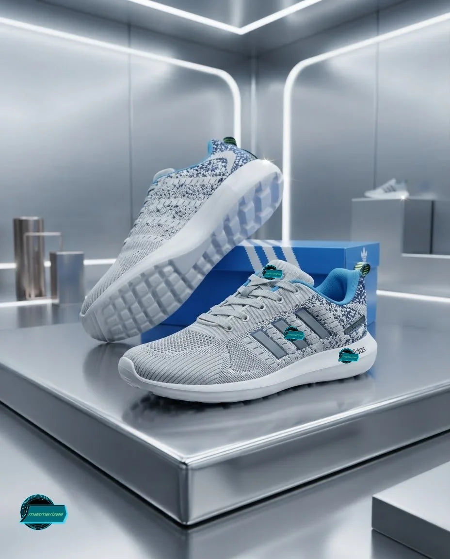 Mesmerizee light grey premium running mesh sneakers for men on a display stand.